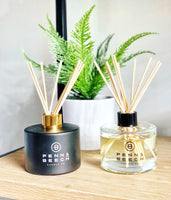 Black and clear reed diffusers with fern